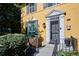Welcoming front porch with a decorative door, cozy seating, and lovely landscaping at 263 N Logan St, Denver, CO 80203