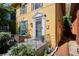 Inviting front porch with a stylish door, comfortable seating, and lush landscaping at 263 N Logan St, Denver, CO 80203