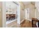 View from the hallway reveals an elegant dining area and an adjacent bathroom at 263 N Logan St, Denver, CO 80203