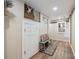 Entryway/hallway featuring a storage area, bench with pillows, and wood-look floors at 263 N Logan St, Denver, CO 80203