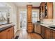 Charming kitchen featuring wood cabinets, stainless steel appliances, and hardwood floors at 263 N Logan St, Denver, CO 80203