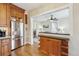 View from kitchen shows stainless appliances and convenient bar area seating at 263 N Logan St, Denver, CO 80203