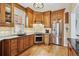 Updated kitchen featuring stainless appliances, tile backsplash, and wood cabinetry at 263 N Logan St, Denver, CO 80203
