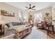 Cozy living room with a ceiling fan, neutral paint, and bright, airy windows at 263 N Logan St, Denver, CO 80203