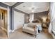 Well-lit main bedroom with seating, ceiling fan, and closet at 263 N Logan St, Denver, CO 80203
