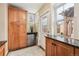 Mud room featuring built-in cabinets, granite countertops and views to the back yard at 263 N Logan St, Denver, CO 80203
