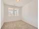 Bright bedroom with carpet, white walls, and scenic views from the double windows at 13725 Daffodil Pt, Parker, CO 80134