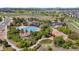 Aerial view of community pool, park, playground, and clubhouse surrounded by lush landscaping at 3575 White Rose Loop, Castle Rock, CO 80108