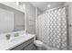 Modern bathroom featuring sleek vanity, decorative wall art, and shower with stylish patterned curtain at 3575 White Rose Loop, Castle Rock, CO 80108