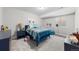 Charming bedroom with a comfortable blue bed, side table, and delightful decor at 3575 White Rose Loop, Castle Rock, CO 80108