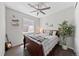 Cozy bedroom with ceiling fan, decorative shelves, stylish accents, and comfortable dark wood bed frame at 3575 White Rose Loop, Castle Rock, CO 80108