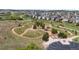 Community dog park with walking trails, trees, and fencing for neighborhood pets to play and socialize at 3575 White Rose Loop, Castle Rock, CO 80108