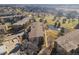 Aerial view showcasing the building's proximity to the pond, golf course, trees, and walking path at 13618 E Bethany Pl # 306, Aurora, CO 80014