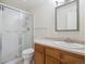Bathroom featuring tiled shower, vanity and mirror at 13618 E Bethany Pl # 306, Aurora, CO 80014
