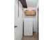 Hallway with storage cabinet and a full-size refrigerator at 13618 E Bethany Pl # 306, Aurora, CO 80014