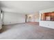 Spacious living room with an open layout, showcasing neutral decor and seamless flow into other areas of the home at 13618 E Bethany Pl # 306, Aurora, CO 80014