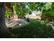 Lush backyard featuring mature trees, a stone patio, and ample lawn space at 5630 W 115Th Ave, Westminster, CO 80020
