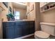 A small half-bath features a single sink vanity, toilet, and bright, neutral paint at 5630 W 115Th Ave, Westminster, CO 80020