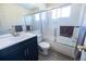 Bright bathroom features a tub/shower and single sink with modern vanity and hard surface floors at 5630 W 115Th Ave, Westminster, CO 80020