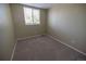 Empty bedroom with a window offers natural light and features neutral paint and carpet at 5630 W 115Th Ave, Westminster, CO 80020