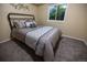 Cozy bedroom featuring a comfortable bed with plush bedding and a window providing natural light at 5630 W 115Th Ave, Westminster, CO 80020