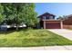 Charming two-story home features a well-manicured lawn, mature shade tree, and attached two-car garage at 5630 W 115Th Ave, Westminster, CO 80020