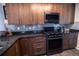 A Kitchen with updated cabinets, modern appliances, and sleek granite countertops at 5630 W 115Th Ave, Westminster, CO 80020