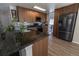 A modern kitchen with stainless steel appliances, granite counters and wood cabinets at 5630 W 115Th Ave, Westminster, CO 80020