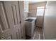 Efficient laundry room with modern washer and dryer, storage shelves, and a window at 5630 W 115Th Ave, Westminster, CO 80020