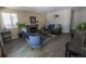 An open-concept living room featuring a fireplace, comfortable seating, and stylish décor at 5630 W 115Th Ave, Westminster, CO 80020