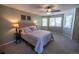 Comfortable main bedroom with bay windows, ceiling fan, and neutral carpet and paint at 5630 W 115Th Ave, Westminster, CO 80020