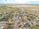 Aerial view highlighting property location within a well-planned community and open spaces at 1535 Peach Ct, Brighton, CO 80601