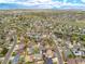 Wide aerial shot showcasing property within a vibrant community near open spaces and amenities at 1535 Peach Ct, Brighton, CO 80601