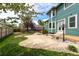 Lush backyard featuring a custom patio and garden at 1535 Peach Ct, Brighton, CO 80601