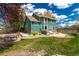 Spacious backyard with a patio and landscaping at 1535 Peach Ct, Brighton, CO 80601