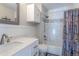 Well-lit bathroom featuring a shower-tub combination and a modern vanity with ample storage at 1535 Peach Ct, Brighton, CO 80601