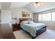 Bright bedroom with a large window, ceiling fan, neutral walls and carpet at 1535 Peach Ct, Brighton, CO 80601