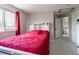 Cozy bedroom with an attached bathroom and open staircase at 1535 Peach Ct, Brighton, CO 80601