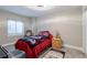 Inviting bedroom with natural light and hardwood floors at 1535 Peach Ct, Brighton, CO 80601