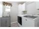 Bright laundry room with modern washer and dryer at 1535 Peach Ct, Brighton, CO 80601