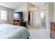 Spacious main bedroom with a large window, walk-in closet, and ensuite bathroom at 1535 Peach Ct, Brighton, CO 80601