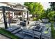 This spacious backyard offers a patio with a fire pit and a water feature at 4181 S Ivy Ln, Cherry Hills Village, CO 80111