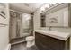 Bathroom with glass enclosed shower, modern vanity and tile floor at 4181 S Ivy Ln, Cherry Hills Village, CO 80111