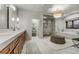 This bathroom is well appointed with a large vanity, glass shower, and soaking tub at 4181 S Ivy Ln, Cherry Hills Village, CO 80111