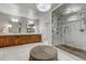 This primary bathroom features a glass shower, a dual sink vanity, and recessed lighting at 4181 S Ivy Ln, Cherry Hills Village, CO 80111