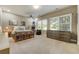This bedroom features natural light, wall art, and an airplane hanging from the ceiling at 4181 S Ivy Ln, Cherry Hills Village, CO 80111