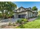Stately home with a brick facade, well-manicured landscaping, and a spacious three-car garage at 4181 S Ivy Ln, Cherry Hills Village, CO 80111