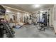 Home gym with free weights, elliptical machines, and mirrored walls at 4181 S Ivy Ln, Cherry Hills Village, CO 80111