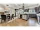 Modern kitchen with dark gray cabinets, stainless steel appliances, and a wine fridge at 4181 S Ivy Ln, Cherry Hills Village, CO 80111
