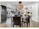 Kitchen featuring an island with bar seating and modern appliances at 4181 S Ivy Ln, Cherry Hills Village, CO 80111